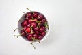 Large cherries on a white textured background