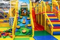 Large children`s playroom with a slide and colorful balls in entertainment center