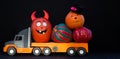 large children\'s toy car truck loaded with many beautiful decorative pumpkins