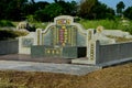 Large Chinese grave and tombstone with golden Mandarin writing at cemetery Ipoh Malaysia