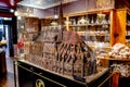 Large chocolate model of the Notre Dame Cathedral in a candy shop in Paris, a concept of consumerism