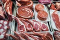 Large choice of different cuts of fresh raw meat at farmers market