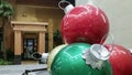 Large Christmas baubles of different colors on display