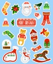 Large Christmas stickers set on blue background.