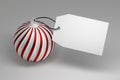Large Christmas toy with white red stripes and blank tag