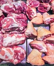 Large chunks of fresh pork and other meat products at the farmers market. Royalty Free Stock Photo