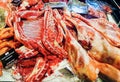 Large chunks of fresh steaks and other meat products at the farmers market. Royalty Free Stock Photo