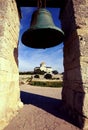 A large church bell and an Orthodox church with a golden dome Royalty Free Stock Photo