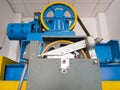 The large circle wheel of the passenger elevator motor in the control room Royalty Free Stock Photo