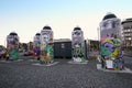 Public city street art of giant painted spray cans with colorful painting, mural, graffiti in Christchurch, New Zealand