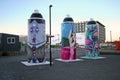 Public city street art of giant painted spray cans with colorful painting, mural, graffiti in Christchurch, New Zealand