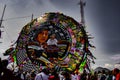 large circular-shaped kite with colors made of china paper with a woman and child painted on it, at the festival, Royalty Free Stock Photo