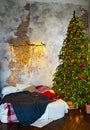 a large classic Christmas tree in the bedroom by the bed in the loft interior.