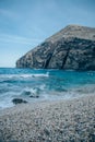 Large cliff on the beach in Playa de los Muertos, Spain