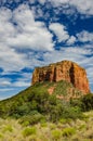 Large cliff in front of the trees under the blue sky full of clouds in Sedona, Arizona Royalty Free Stock Photo