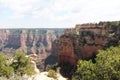 Large cliff in front of the trees under the blue sky in Sedona Royalty Free Stock Photo