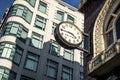 Large clock on brick building in metropolitan city Royalty Free Stock Photo