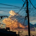 Large cloud imprisoned by a mess of cables Royalty Free Stock Photo