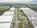 A large cluster of expansive warehouses on former farmland property. Industrial zone in Lipa, Batangas