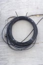 Cable coil on wall Royalty Free Stock Photo