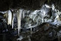 Large cold cave with stalactites and stalagmites