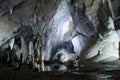 Large cold cave with stalactites and stalagmites