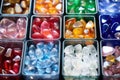large collection of glass gems in containers Royalty Free Stock Photo