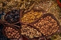 Large collection of nuts, seeds and dried fruits in brown wooden bowls Royalty Free Stock Photo