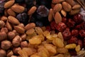 Large collection of nuts, seeds and dried fruits in brown wooden bowls Royalty Free Stock Photo