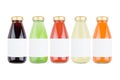 Large collection of summer vegetables juices in glass bottles with blank label and cap, isolated, mock up for design, advertising.