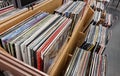 Large collection of vinyl records displayed in wooden bins, diverse popular music album selection at a music store, shop, Royalty Free Stock Photo