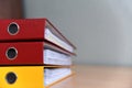 Large color folders for documents on the table in the office, close-up, copy space