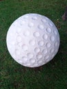 large colored golf balls made of concrete