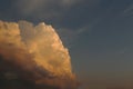 A large colorful cloud against the dark blue sky in the evening Royalty Free Stock Photo