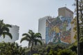 Large colorful mural on side of high rise building celebrating 2016 Olympic games in Lapa neighbourhood of central Rio in Brazil