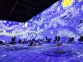 Large colorful projected display of Van Gogh arts on the wall in the Van Gogh Immersive Experience Exhibition