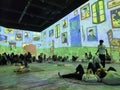 Large colorful projected display of Van Gogh arts on the wall in the Van Gogh Immersive Experience Exhibition