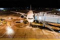 Large commercial airplane at the gate of an airport waiting for passengers to board. Emirates Airlines Boeing 777. Hanoi, Vietnam