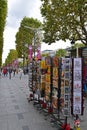 Small local roadside souvenir gift store shop with postcard, vintage Cartexpo, drawing on display at Champs-Elysees Paris France