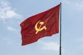 Large communist flag floating in the wind
