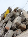 Large concrete chunks with twisted metal on a demolition site