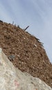 Large concrete chunks with twisted metal and industrial building Royalty Free Stock Photo