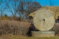 Large concrete millstone in public park