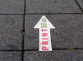 Large concrete tile sidewalk paving with white and red PRINT sign