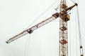 Large construction crane builds a house Royalty Free Stock Photo