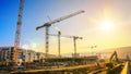 Large construction site including several cranes, with clear sky Royalty Free Stock Photo