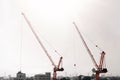 Large construction site including several cranes working on a building complex Royalty Free Stock Photo