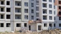 Large construction site. The process of capital construction of a high-rise residential complex. Modern residential building.