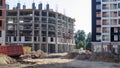 Large construction site. The process of capital construction of a high-rise residential complex. Modern residential building.