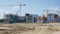 Large construction site. The process of capital construction of a high-rise residential complex. Modern residential building.